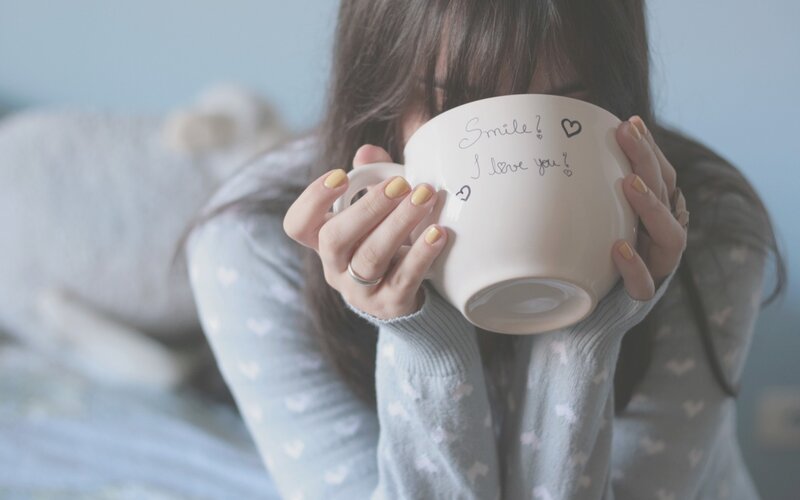 person holding a mug
