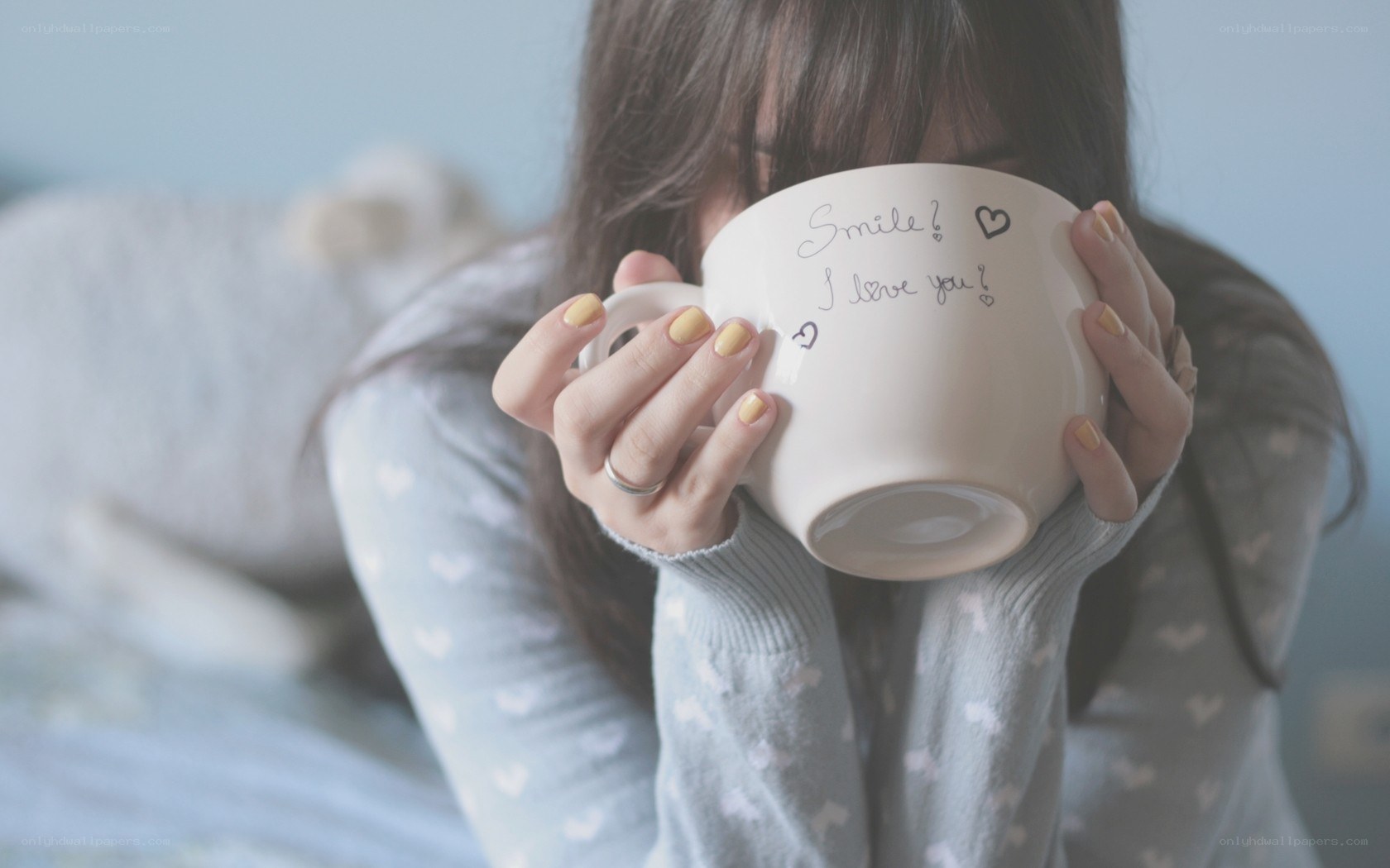 person holding a mug