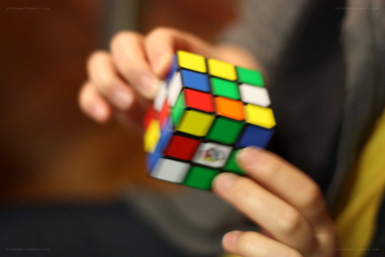 person holding a rubik's cube