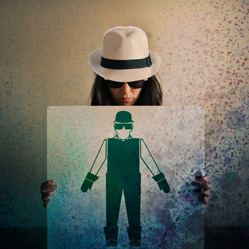person holding a sign with a silhouette