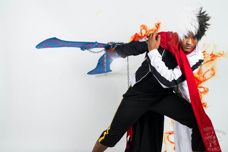 Person Holding a Sword — Black, Dramatic, Photograph, Fire