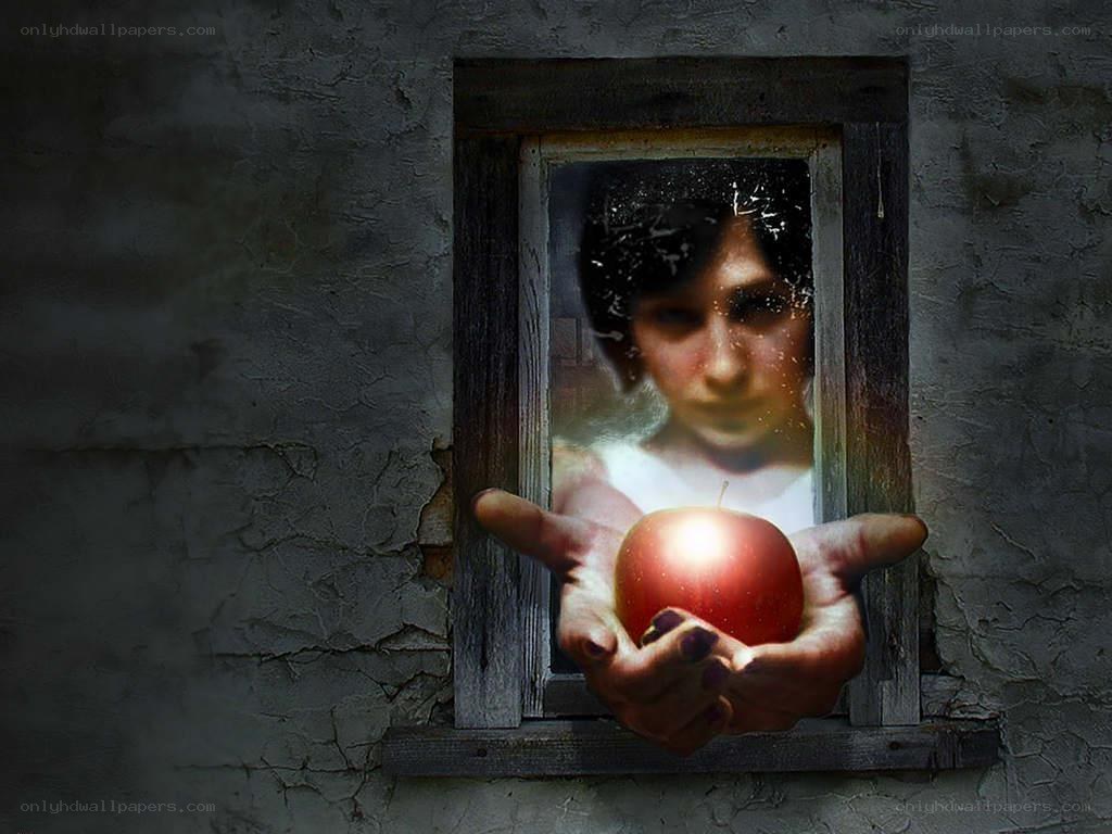 person holding apple through window