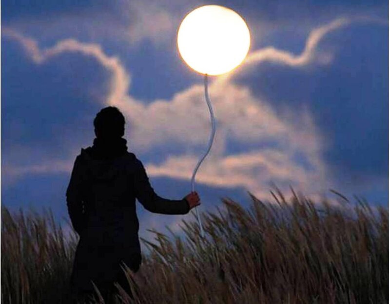 Person Holding Balloon — Blue