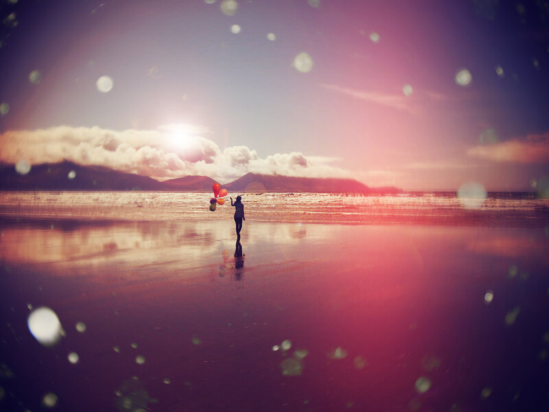 Person Holding Balloons — Pink