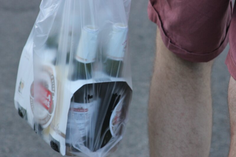 person holding beer bottles