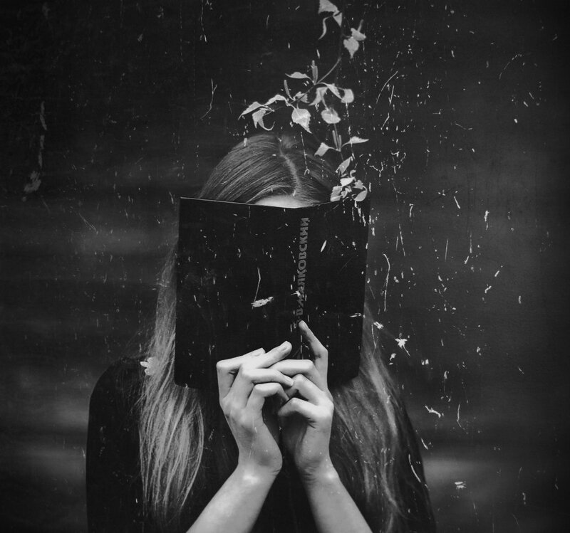 Person Holding Book — Black, Dramatic