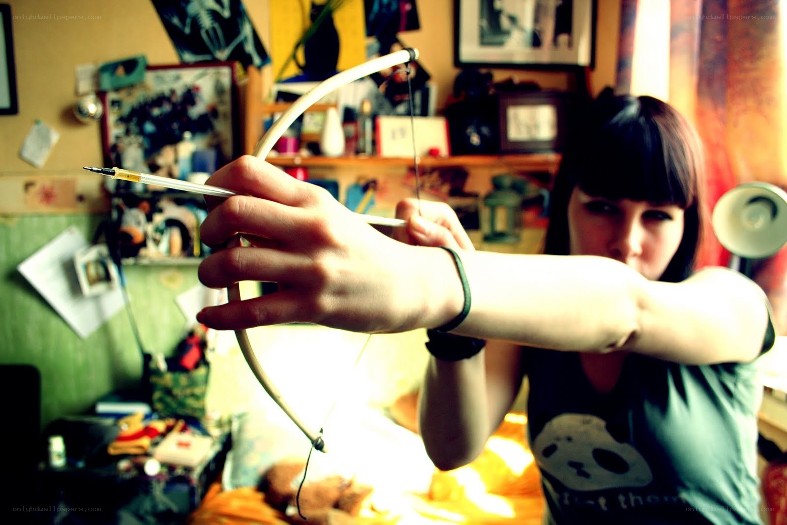 person holding bow and arrow