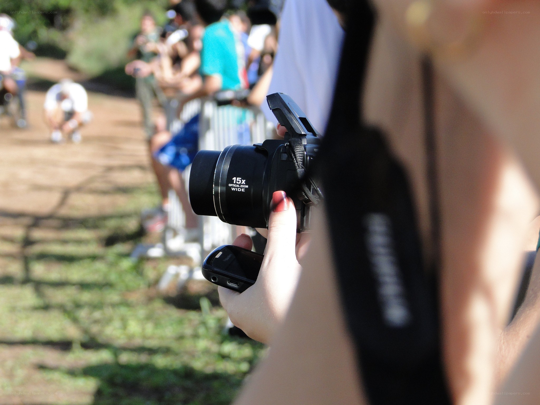 person holding camera at event