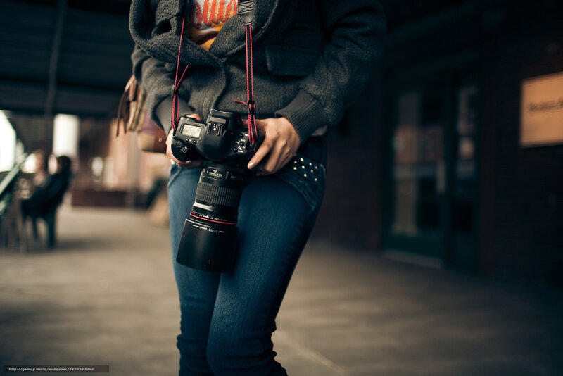 Person Holding Camera — Black, Neutral, Photograph, Jeans