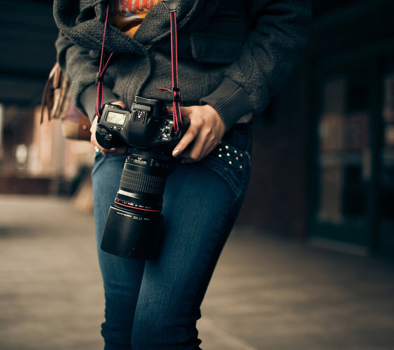 Person Holding Camera — Black, Neutral, Photograph