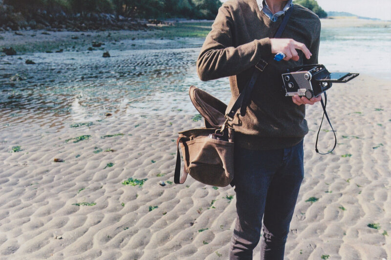 Person Holding Camera — Brown