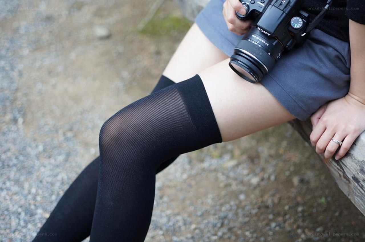 person holding camera outdoors
