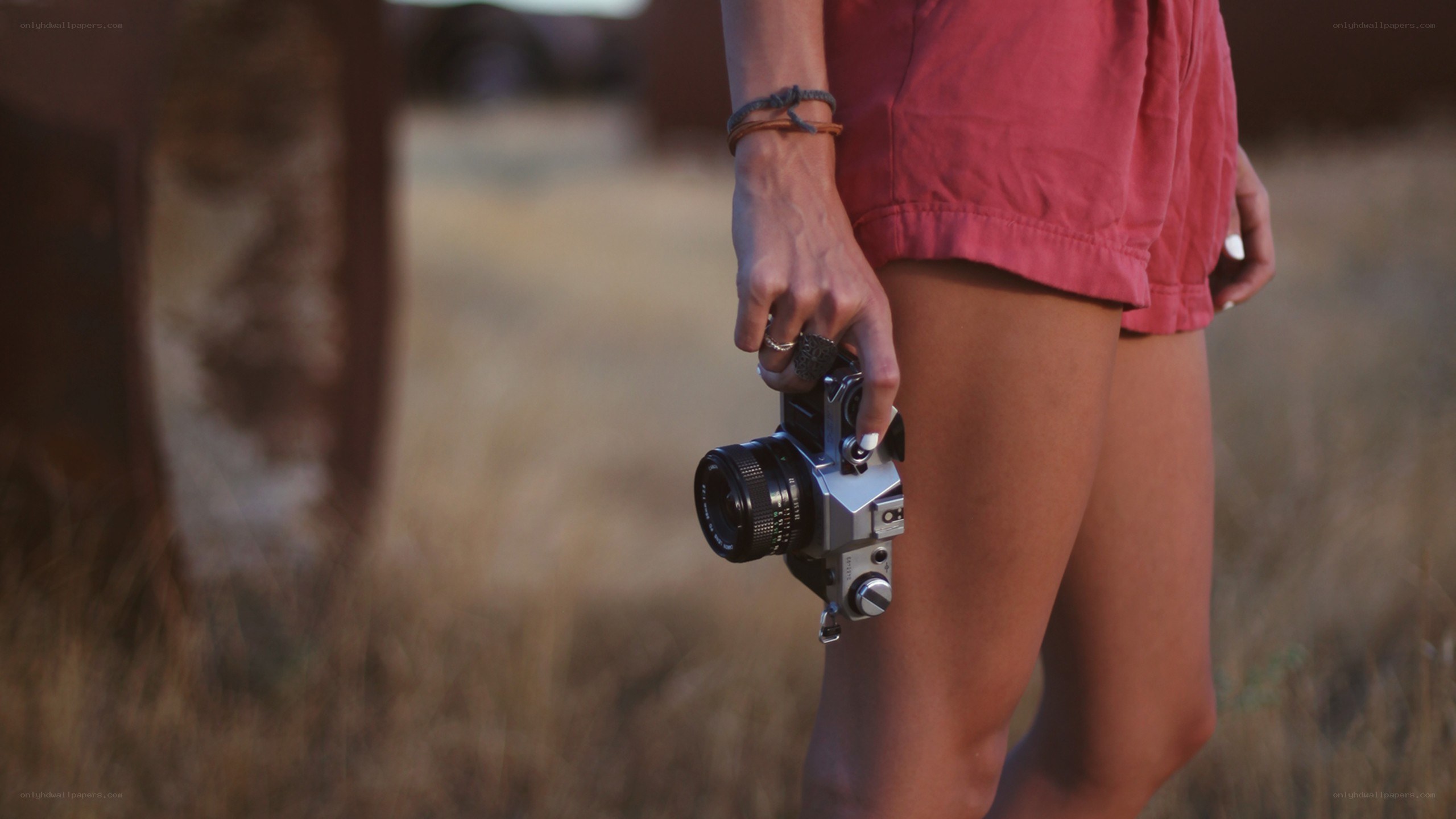 person holding camera outdoors