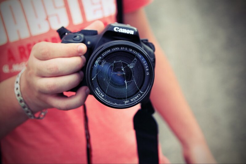 Person Holding Camera — Red, Neutral, Photograph, Hand