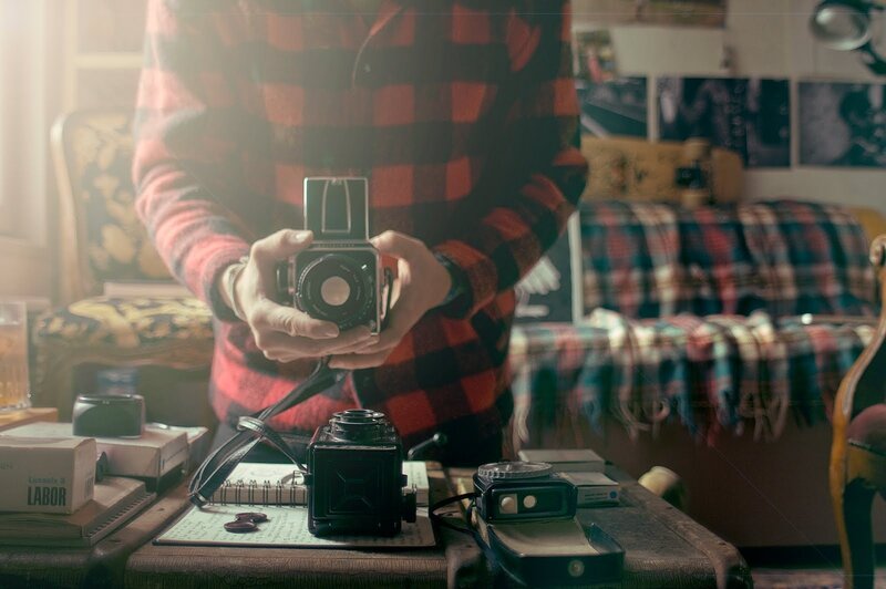 Person Holding Camera — Red, Warm