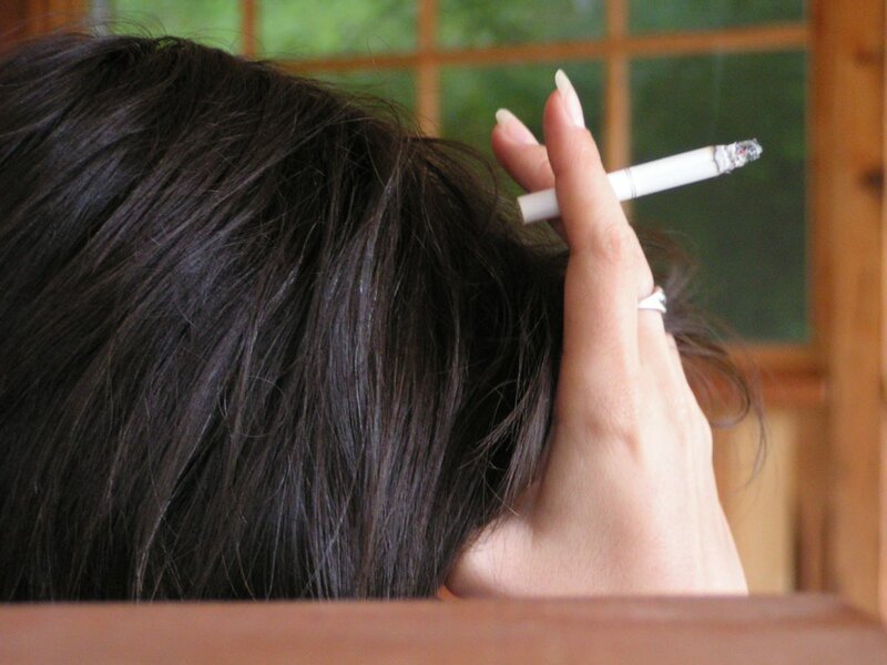 Person Holding Cigarette