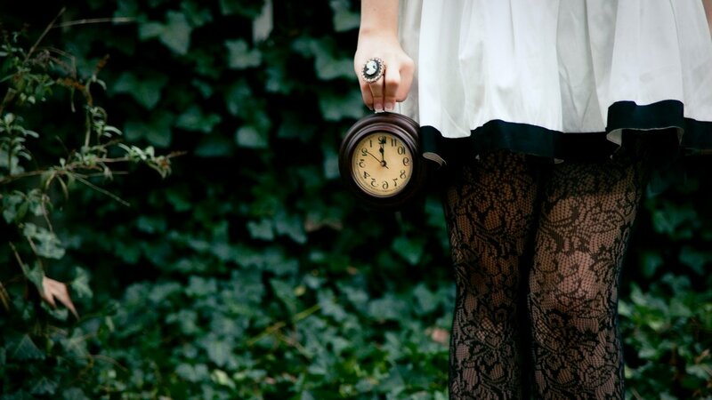 Person Holding Clock