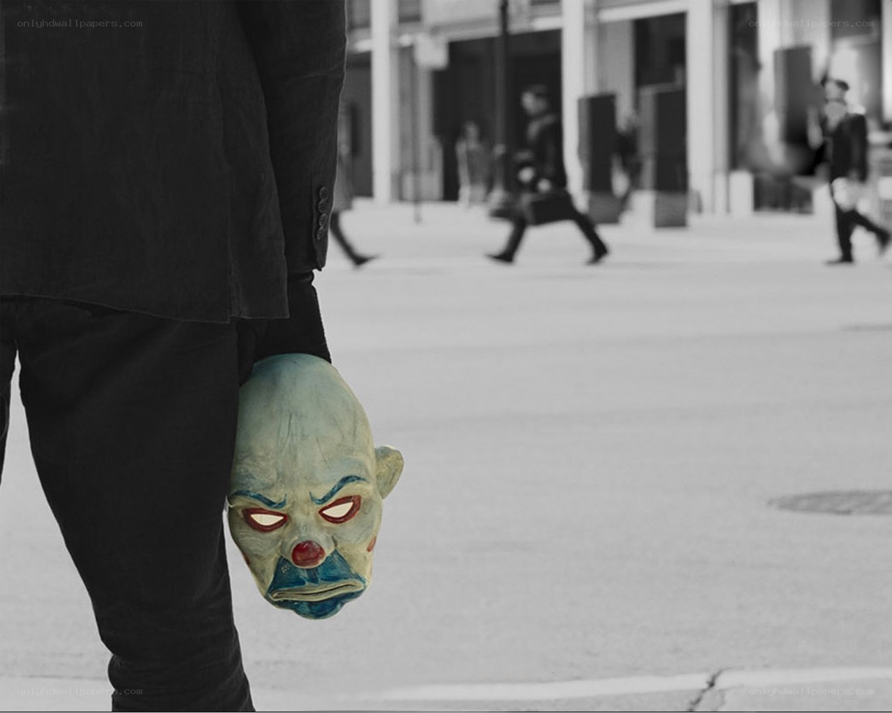 person holding clown mask