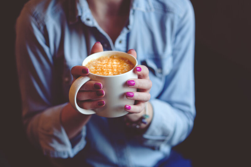 Person Holding Coffee Cup — Blue