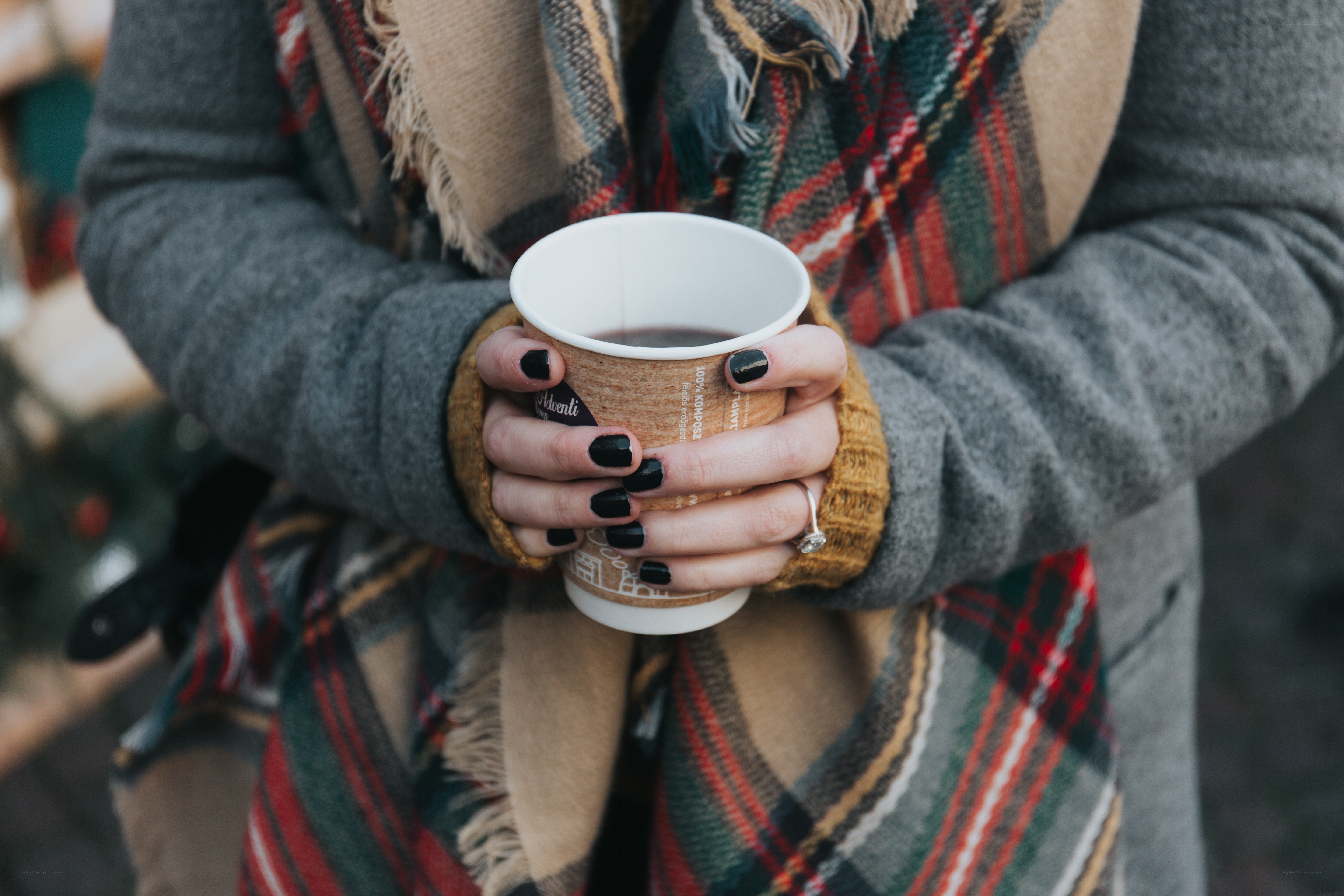 person holding coffee cup