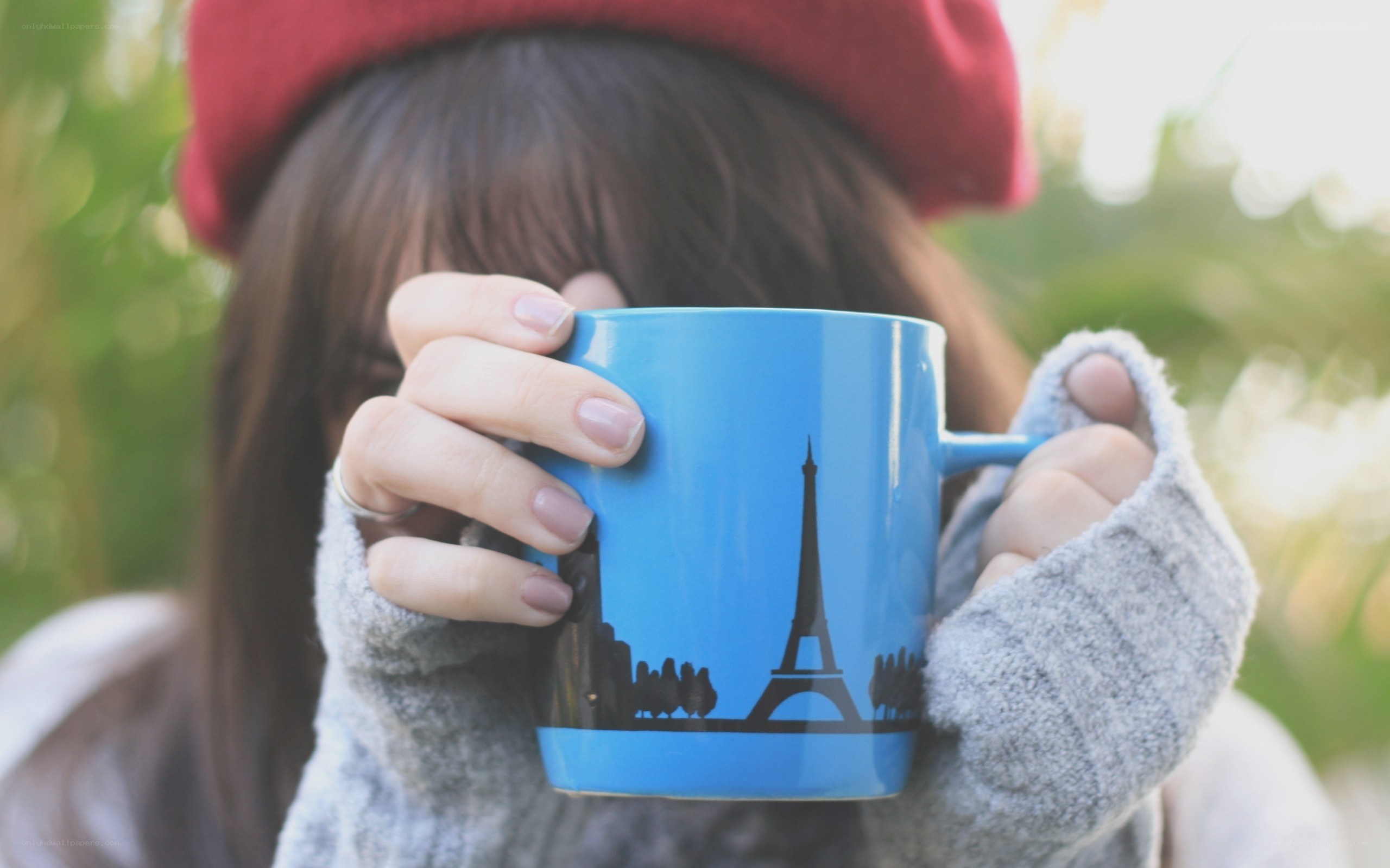 person holding coffee mug