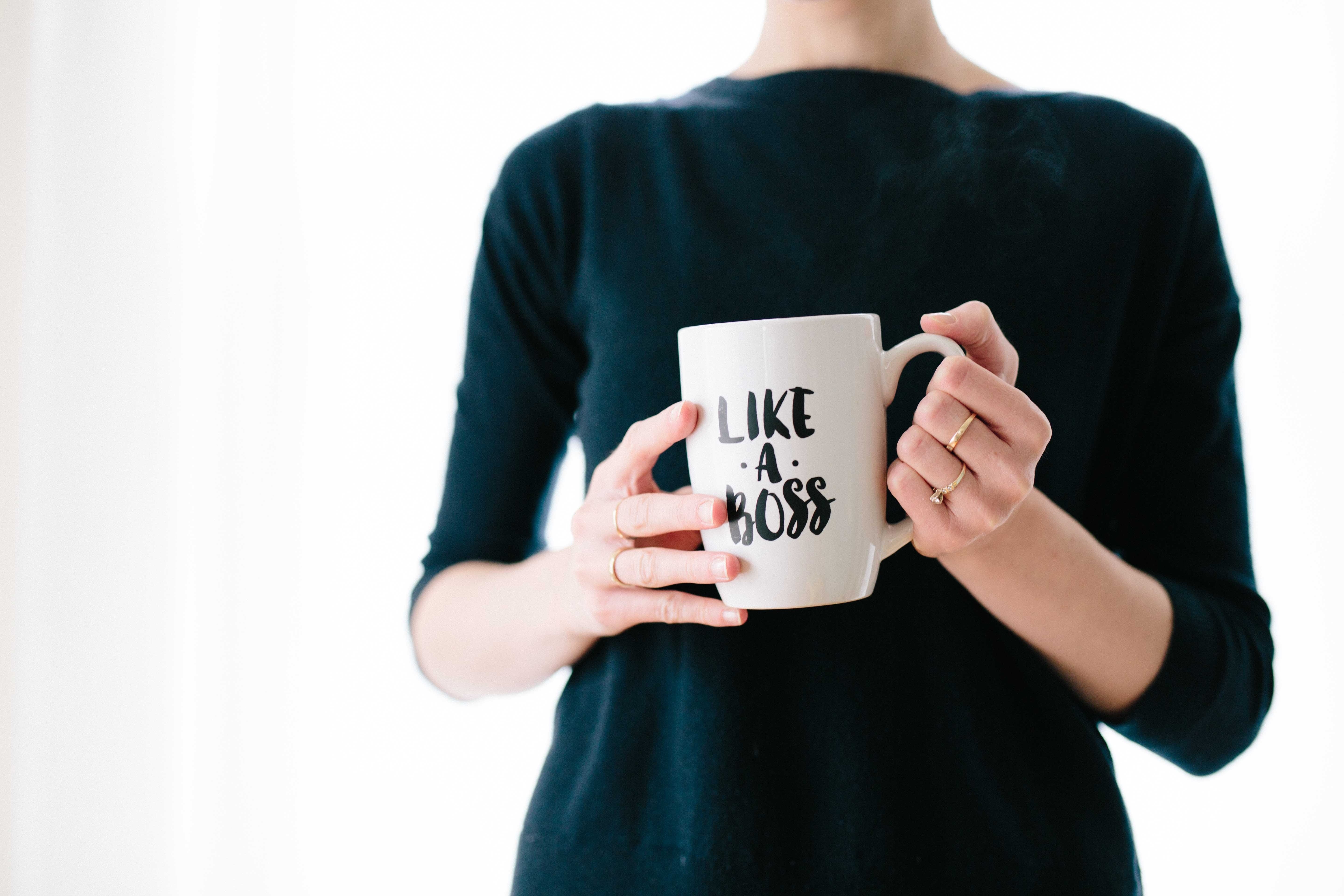 person holding coffee mug