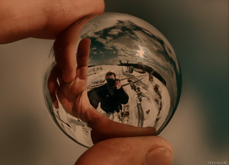 Person Holding Crystal Ball