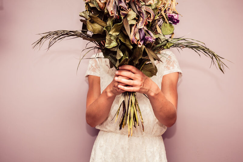 Person Holding Dried Flowers