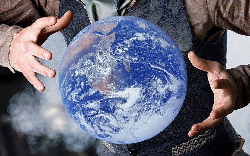 Person Holding Earth
