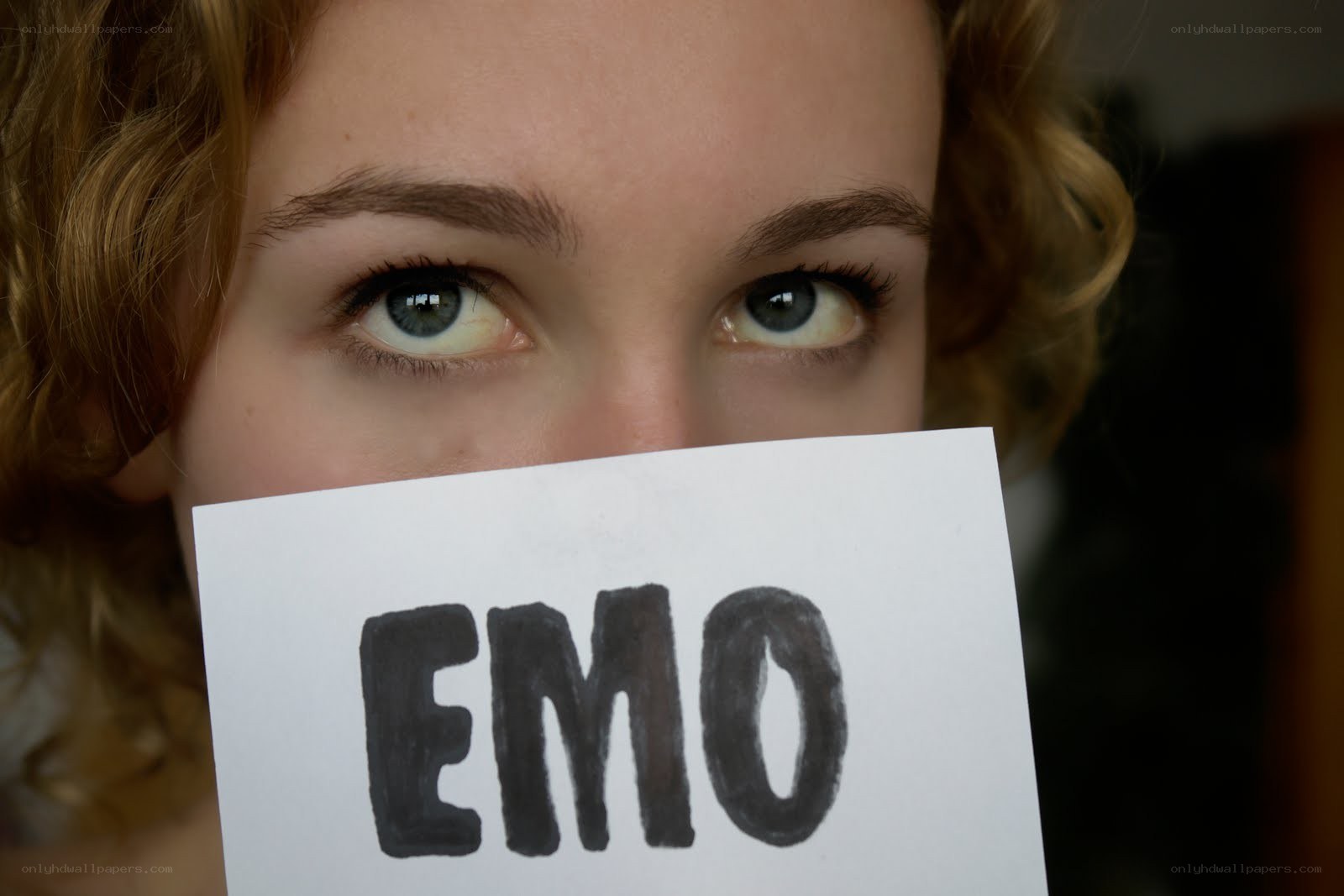 person holding EMO sign