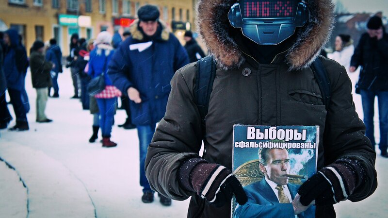 person holding fake election poster