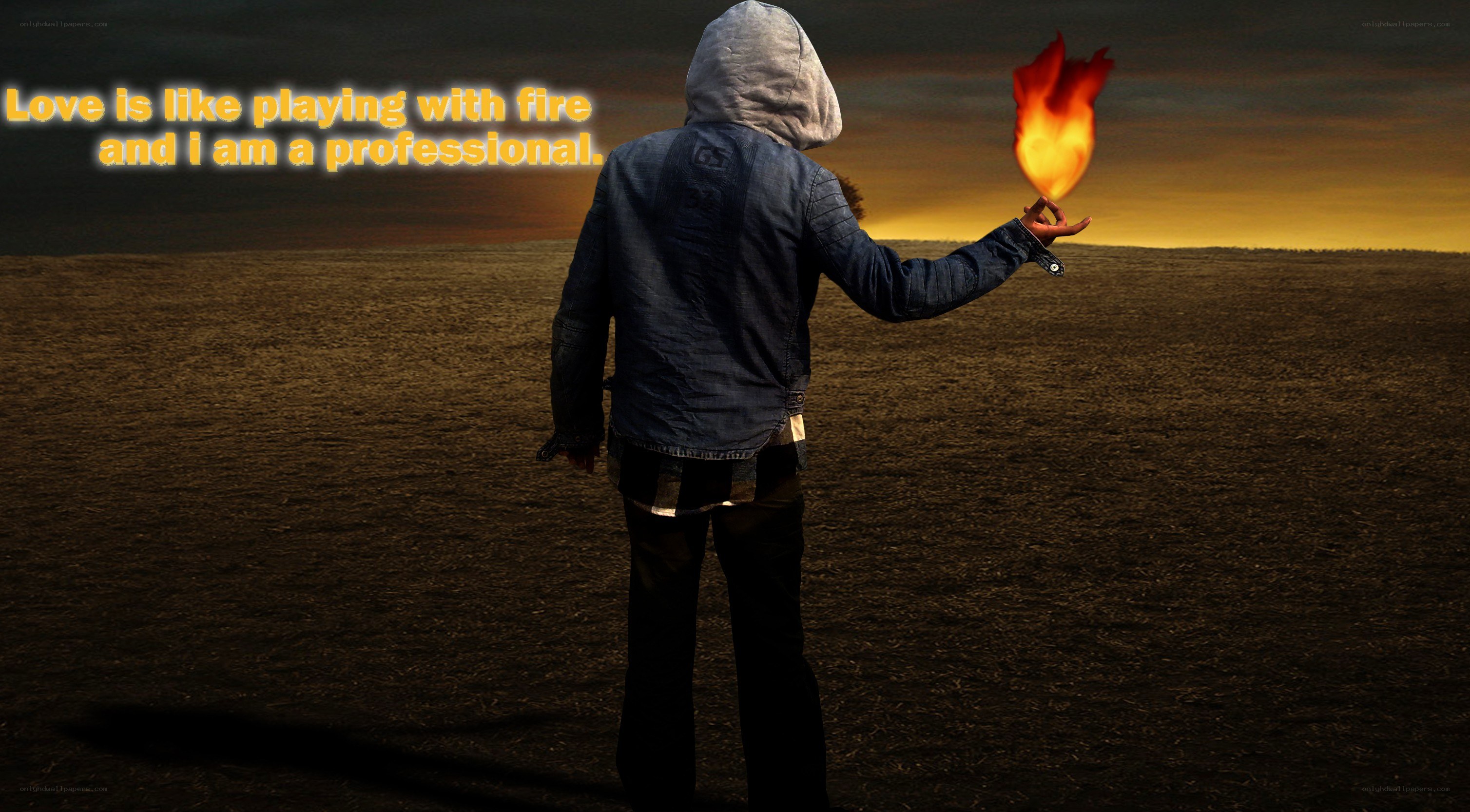 person holding fire in desert