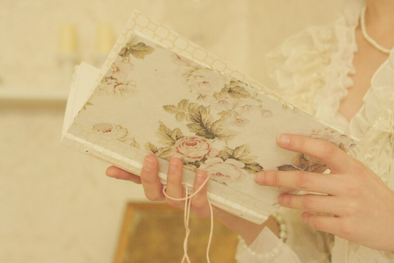 Person Holding Floral Book