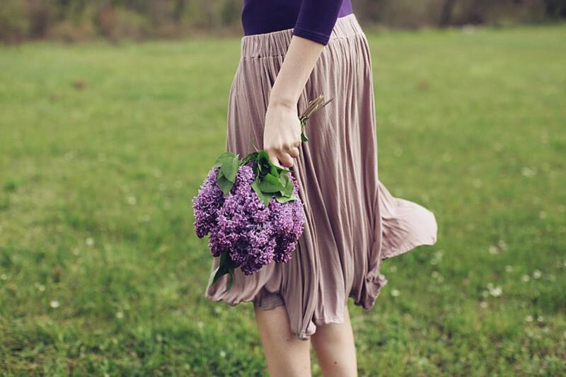 Person Holding Flowers — Purple