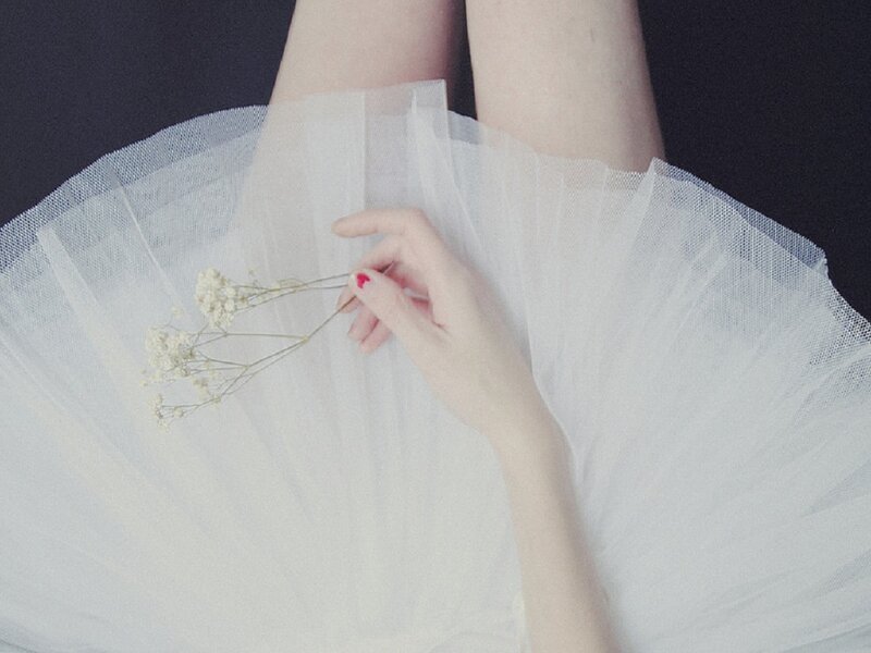 Person Holding Flowers — White