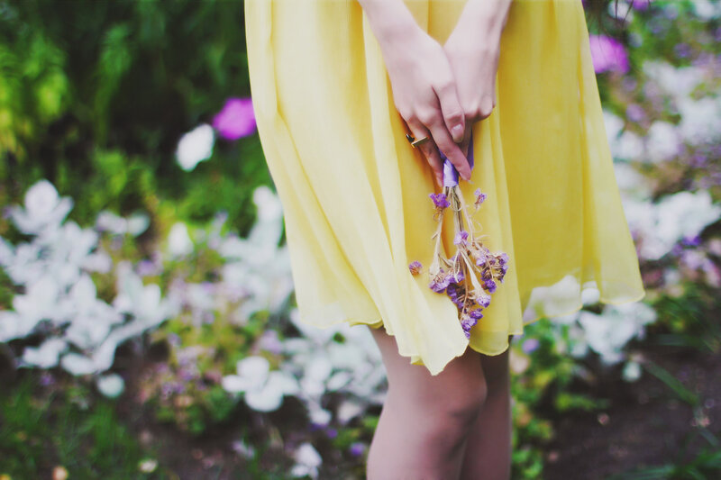 Person Holding Flowers — Yellow