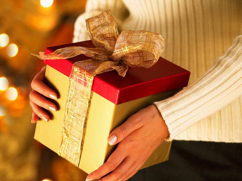 Person Holding Gift Box — Gold
