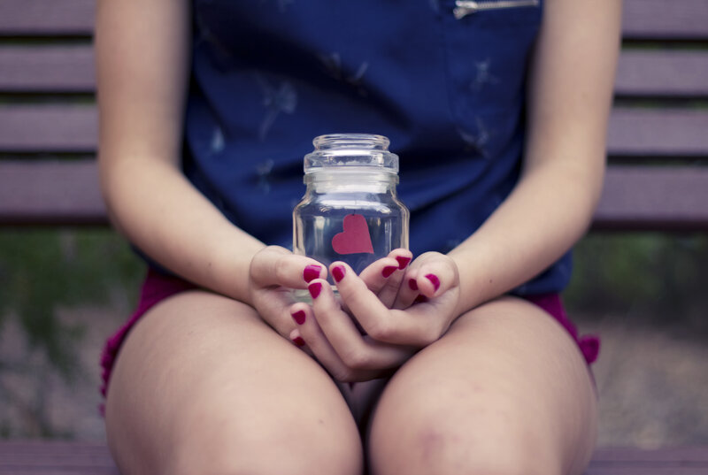 Person Holding Glass Jar