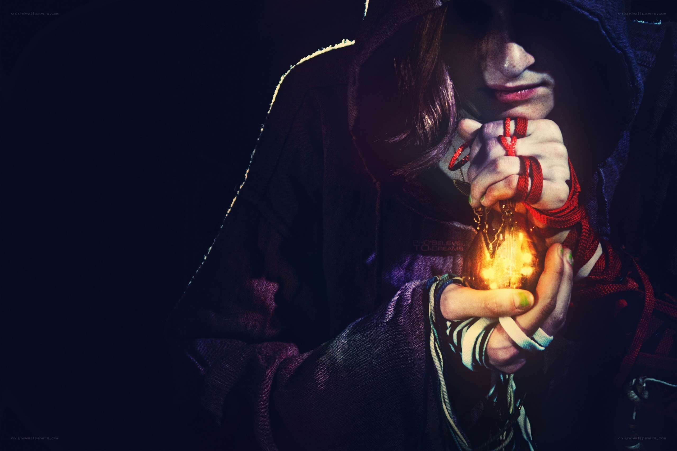 person holding glowing orb