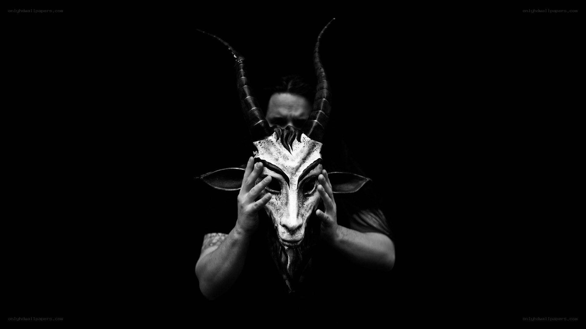 person holding goat mask