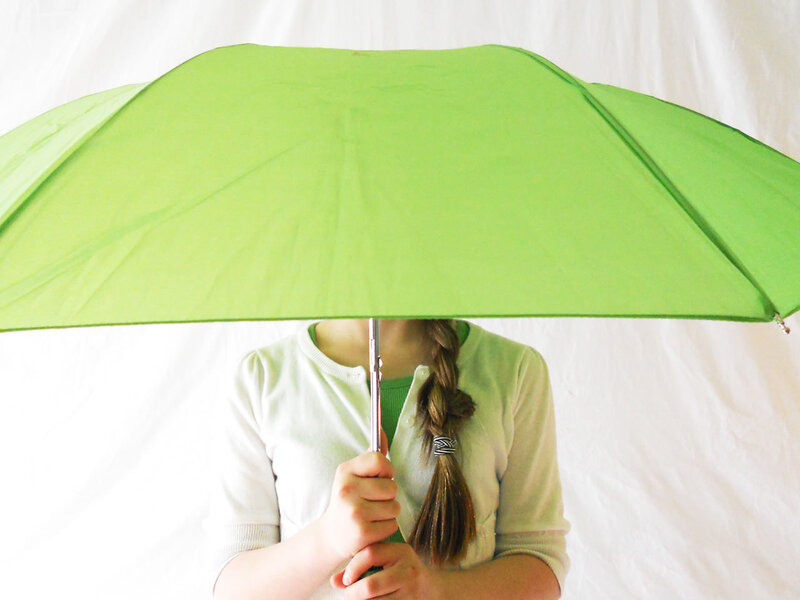 Person Holding Green Umbrella