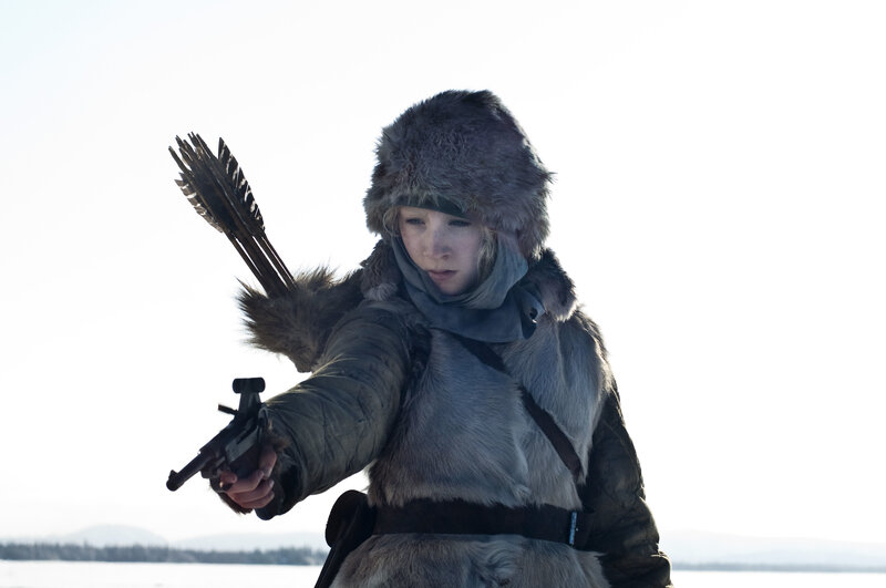person holding gun in winter