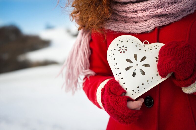 Person Holding Heart Ornament — Red