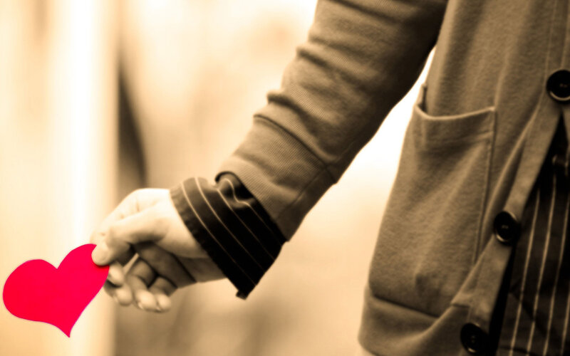 Person Holding Heart — Red