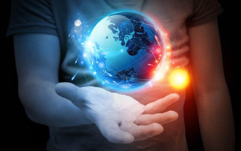 Person Holding Holographic Globe