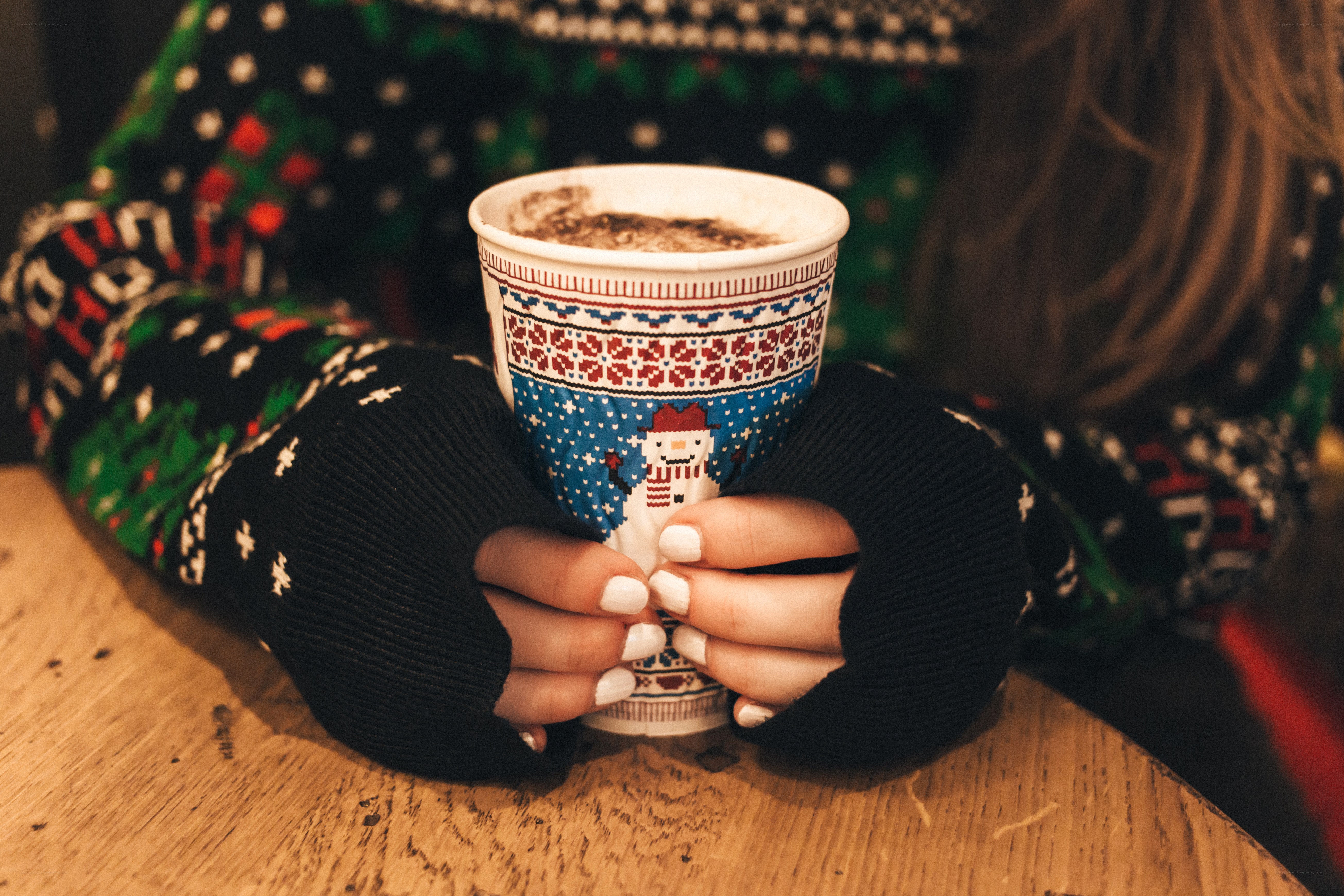 person holding hot drink