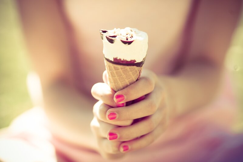 person holding ice cream cone