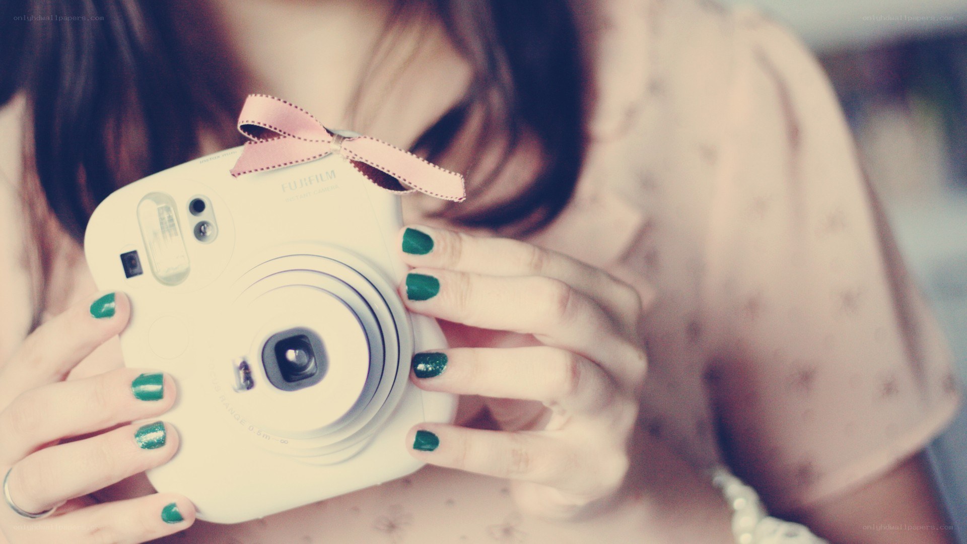 person holding instant camera