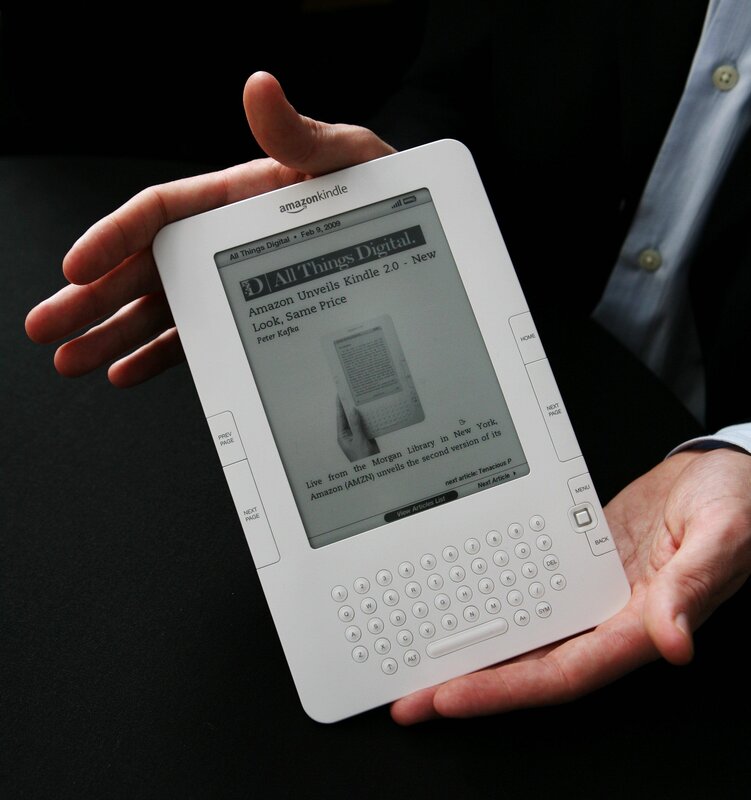 Person holding Kindle e-reader