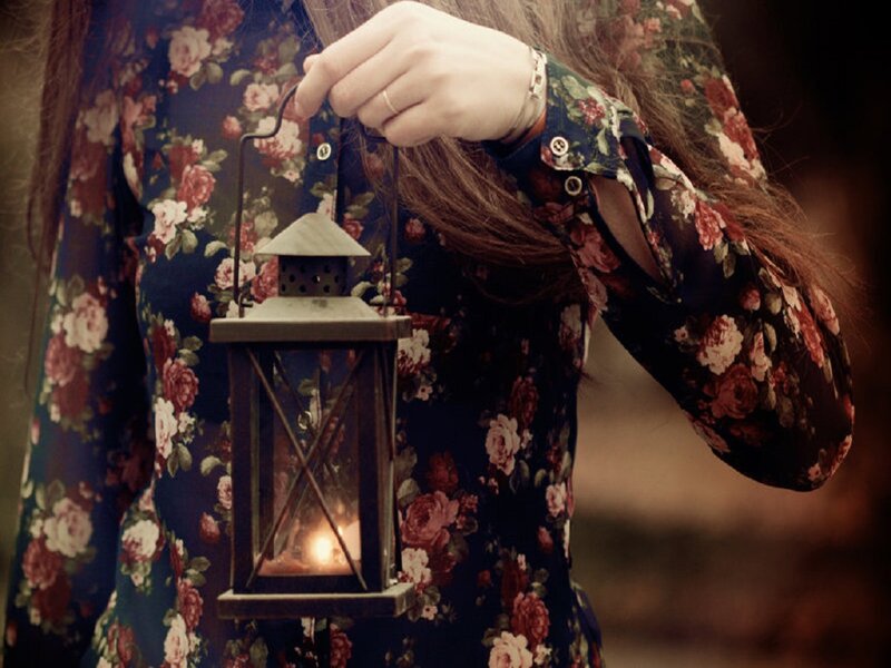 Person Holding Lantern — Blue